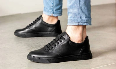 Мужские кеды из натуральной кожи черного цвета на шнуровке